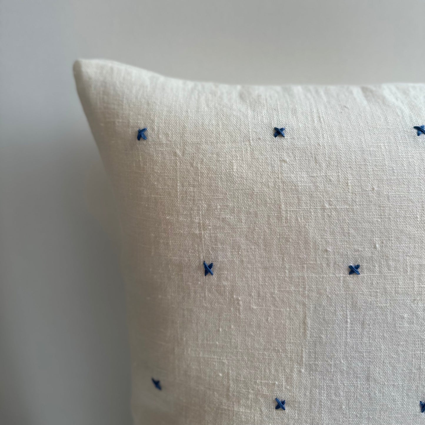 Handmade white linen cushion blue embroidery