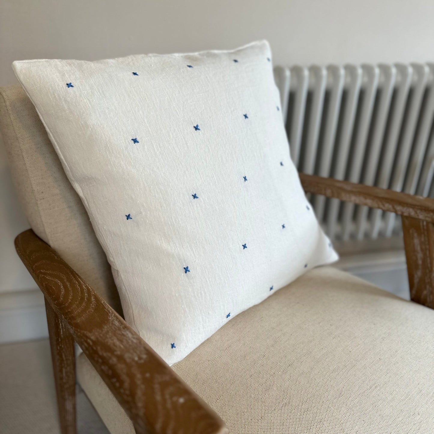 Handmade white linen cushion blue embroidery