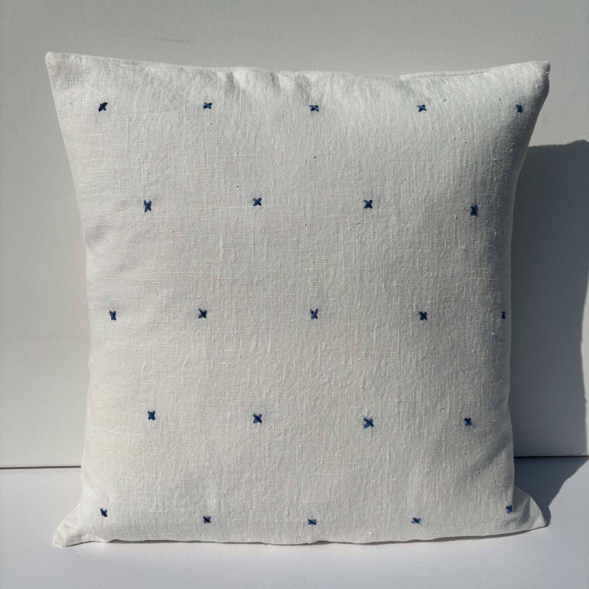 Handmade white linen cushion blue embroidery